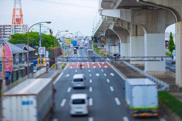 A cityscape of miniature traffic jam at the city street under the overpass