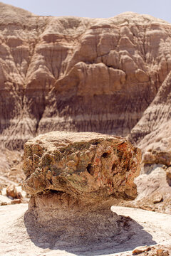 Hoodoo rock formation emerging from the desert floor