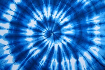 Vibrant blue tie dye spiral pattern abstract fabric texture
