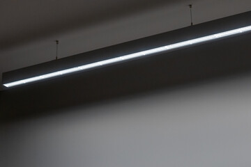 Suspended linear profile lighting featuring a prismatic cover, designed to provide uniform and...