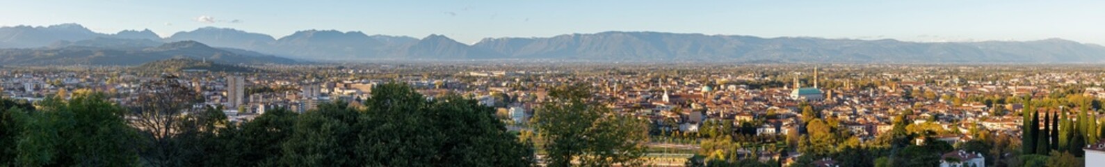Obraz premium The Panorama of Vicenza in evening light wiht Alps in the background.