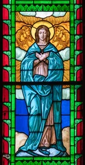 Selbstklebende Fototapeten PIACENZA, ITALY - MAY 20, 2025: The  Immaculate Conception on the stained glass in Cathedral by unknown artist.  © Renáta Sedmáková