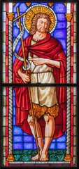 Selbstklebende Fototapeten PIACENZA, ITALY - MAY 20, 2025: The St. John the Baptist in the stained glass in church Basilica di San Francesco by Franz Xaver Zettler from year 1889. © Renáta Sedmáková