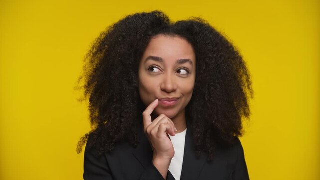 Thoughtful customer deciding between purchase options on yellow