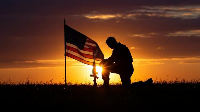 Silhouette of soldier praying at sunset