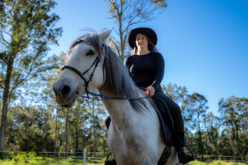 white horse and cowgirl