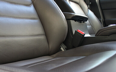 Different types of leather upholstery for car seats with double stitching and perforation for...