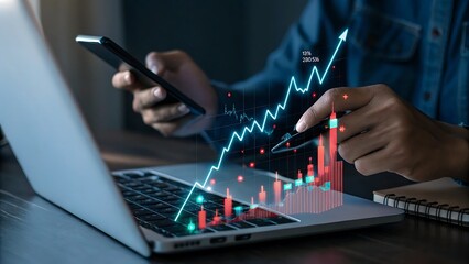 Person analyzing financial growth chart on laptop and smartphone with digital data visualization