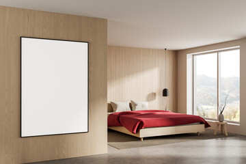 Blank poster mockup on wooden wall in modern bedroom interior with red bed and large window...