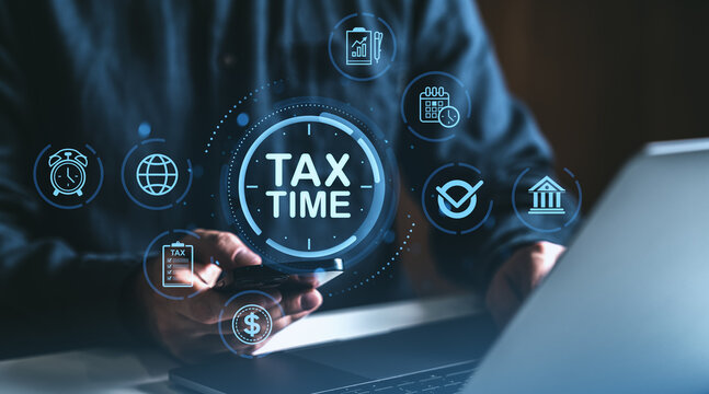 Digital tax time concept with financial icons and businessman using smartphone and laptop in office environment for finance management and planning.