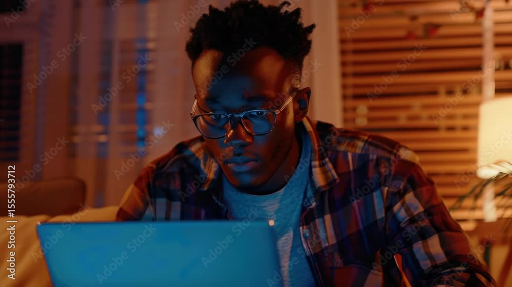 Poster a person working from home, using a laptop and sitting in front of a desk