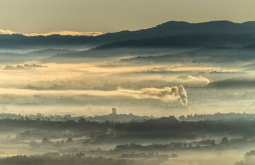 Landscape with mountain views and low clouds.