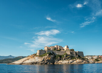 The medieval citadel of Calvi on the west coast of the Mediterranean island of Corsica with blue sky above