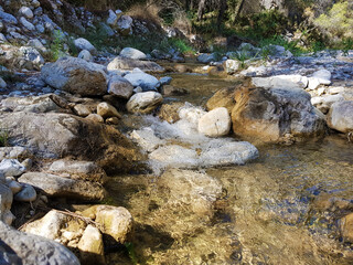 Beautiful image of a calm river flowing between the stones