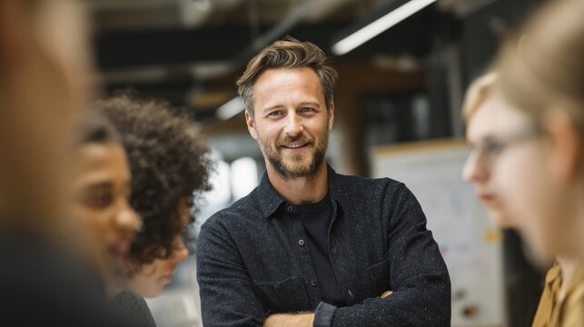 Confident team leader guiding office team in brainstorming session.