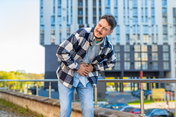 Caucasian mature man traveler feeling sudden strong abdominal stomach ache gastritis problem. Upset...