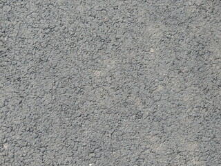 concrete wall with grainy plastered surface, empty textured cement wall background, light space of mortar covered wall