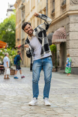 Excited happy man traveler shouting, celebrating success, winning, goal achievement, good news,...