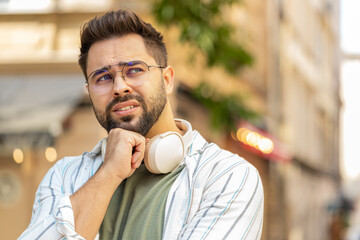 Sad unhappy young man tourist thinks over life concerns, suffers from unfair situation. Problem,...
