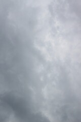 sky filled with dense, gray clouds. The clouds exhibit varying shades of gray and have a textured, layered appearance.