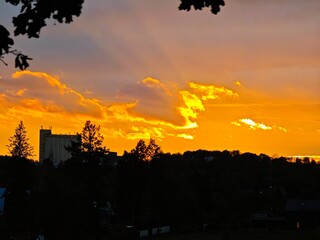 Dramatic Orange Sunset Over City Skyline