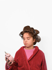 Teen girl fashionista unhappy with early awakening. Funny portrait on white isolated