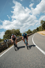 Young athletes cycling fast