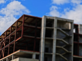 Unfinished building construction site bokeh background