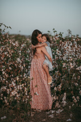 mother and daughter on the field of cotton
