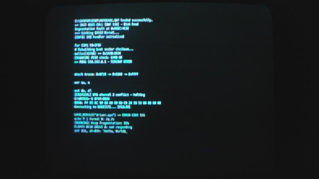 Computer code language in display of computer screen. Black background.