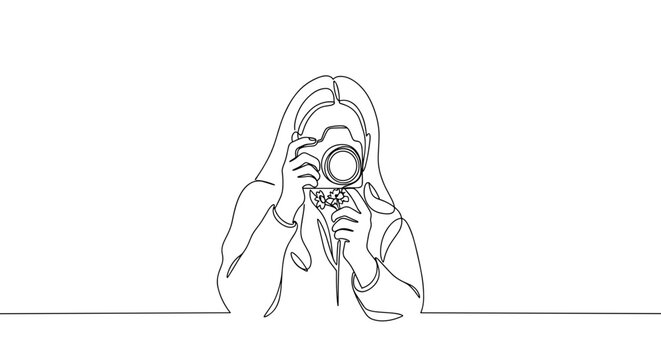 Girl taking macro photo of flower (International Photographer Day)  