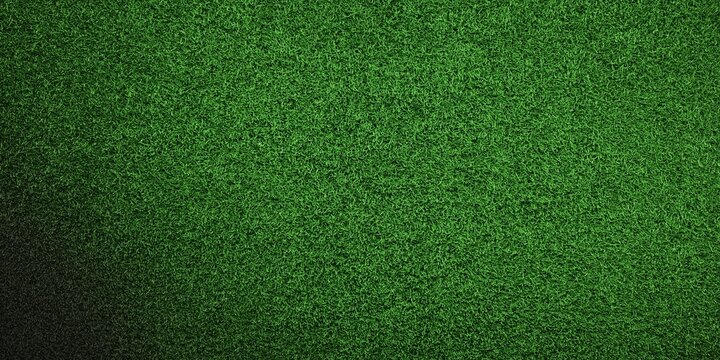 Green football soccer field grass texture background wallpaper with copy space.