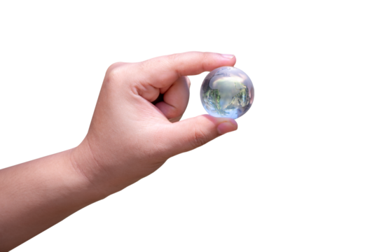 Woman hand holding a glass globe isolated on background. Transparent background. PNG image.