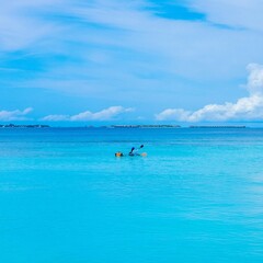 kayaking, Maldives, blue lagoon, tropical water, outdoor adventure, water sport, clear sea, summer vacation, solo travel, exotic destination, turquoise water