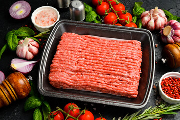 Fresh meat. Mincemeat, minced or ground meat. Meat in a plastic black container from the market....