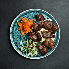 Juicy venison shish kebab. Meat barbecue menu. Free space for text. Close up.