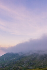 Sunset in the Carpathian Mountains is a magical moment — golden light bathes the peaks, clouds...
