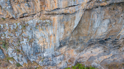 Cefalu Rock, a cliff in Sicily, Italy. Texture of sedimentary rock layers, a close-up view.