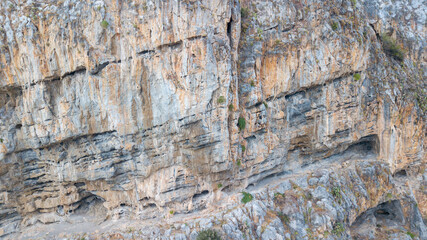 Cefalu Rock, a cliff in Sicily, Italy. Texture of sedimentary rock layers, a close-up view.