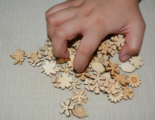 Photo Of A Pile Of Woods Carved Into Flowers