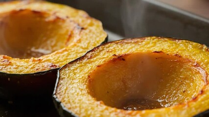 Roasted Acorn Squash Delight: A close-up shot of two halves of roasted acorn squash, their golden, caramelized interiors beckoning with warmth and culinary satisfaction. Perfect for food lovers.