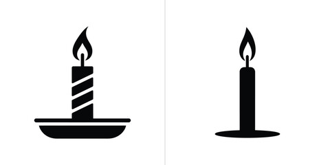 Fototapeta premium Black and White Featuring Two Lit Candles with Distinct Designs and White Background