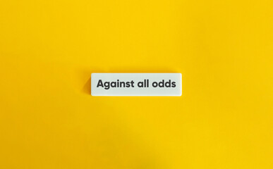 Against All Odds Letter Tiles on Yellow Background – Minimalist Motivational Concept
