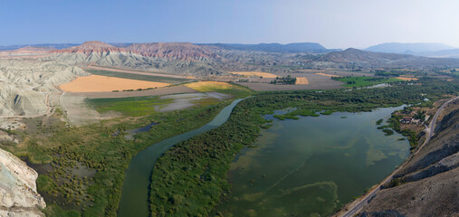 Nallihan Bird Sanctuary Ankara Turkey Panoramic view of a river winding through a colorful landscape. High-angle, panoramic shot of a river snaking through a valley with diverse terrain. Turkiye