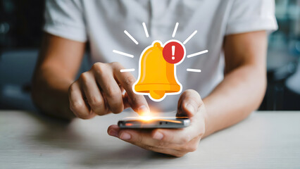 A person interacting with an alert notification on a smartphone, illustrating digital reminders, deadlines, and the importance of staying updated in today's fast-paced technological world.