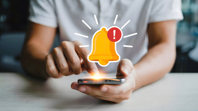A person interacting with an alert notification on a smartphone, illustrating digital reminders, deadlines, and the importance of staying updated in today's fast-paced technological world.