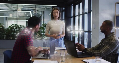 Mid adult female consultant sweeping arm outward, presenting data strategy with binary overlay - Powered by Adobe