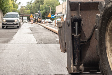 Close-up of excavator bucket during road works