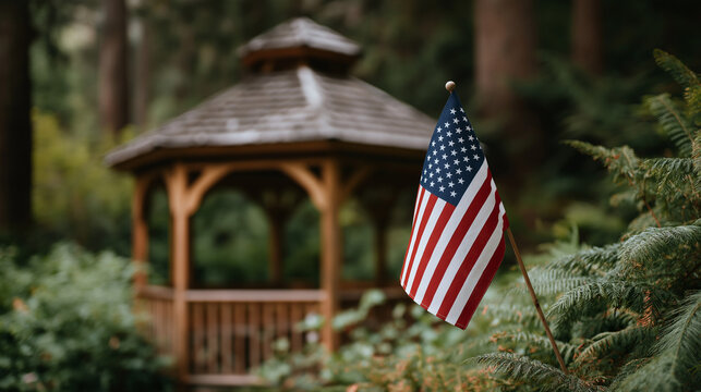 American Flag Displayed by Cozy Gazebo in Forest Clearing