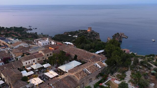 Scopello, vista dall'alto del borgo che affaccia sulla Tonnara. Trapani, Sicilia, Italia. 
Vista aerea panoramica del borgo di Scopello, tra Palermo e San Vito Lo Capo. Riserva dello Zingaro. 
